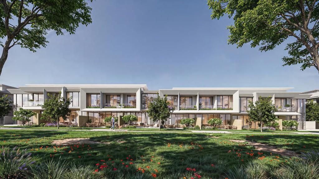 Daytime rendering of Azizi Florence townhouses set in landscaped green open space